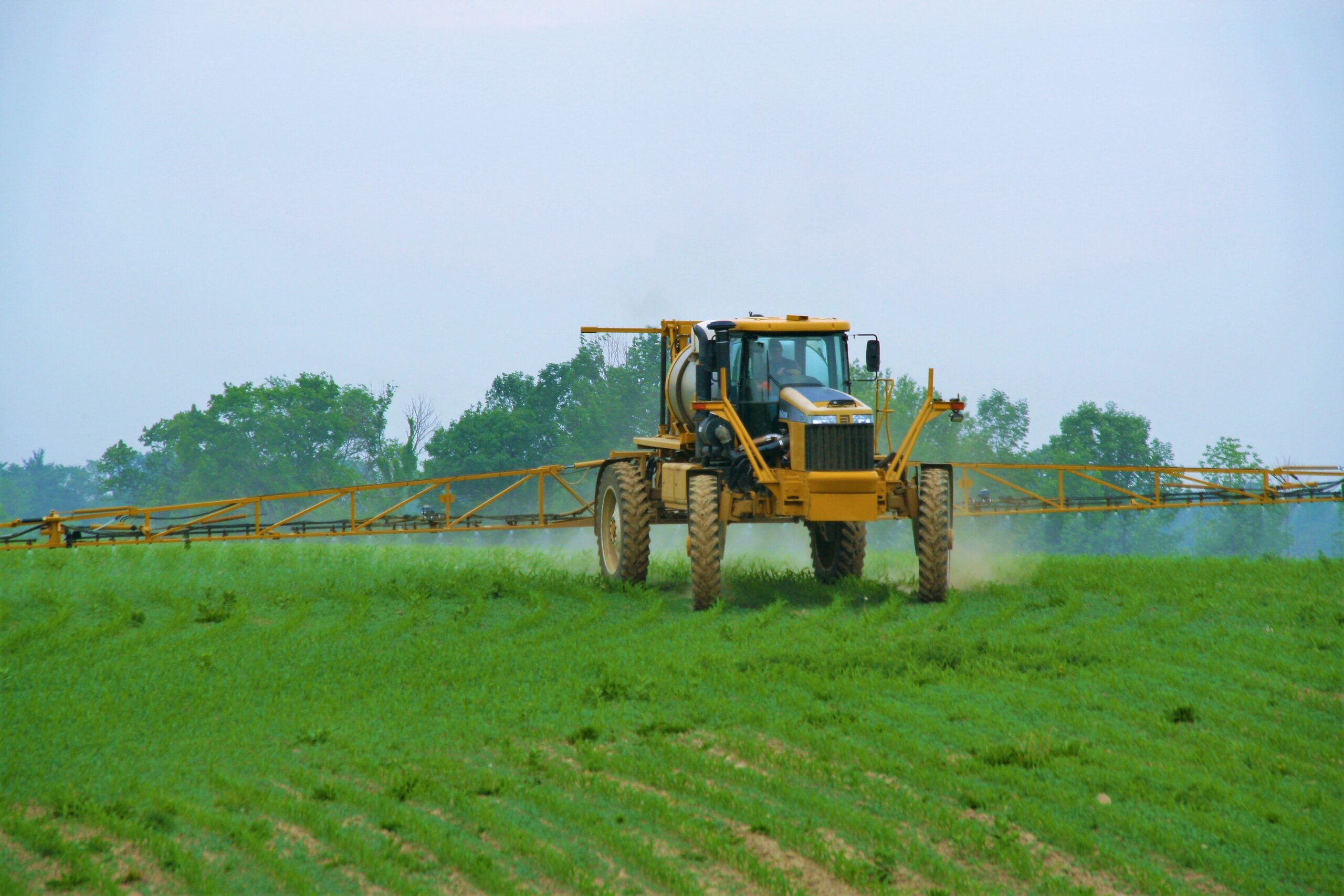 Boom sprayer applying crop protection